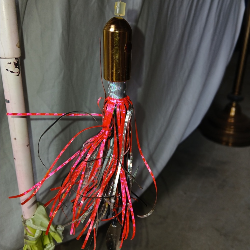 Red and Silver Fishing Lure with Tassel Skirt